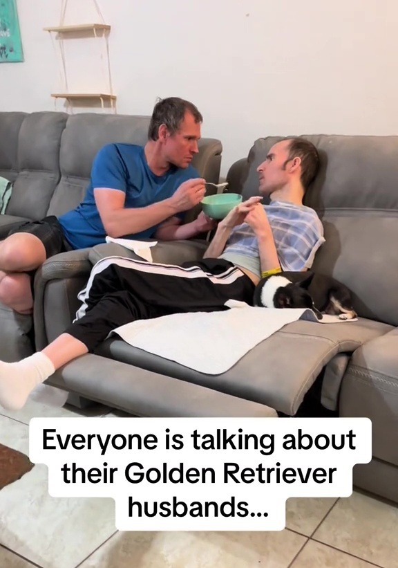 Man feeding his wheelchair-bound husband.
