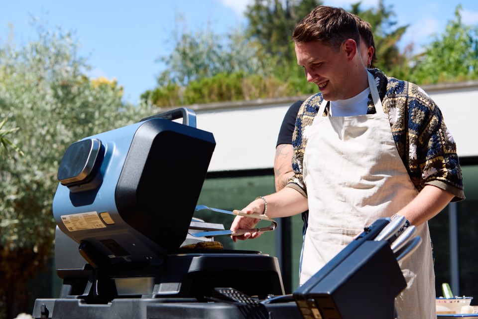 Chris Stark grilling food outdoors.