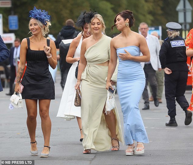 Glamorous racegoers opted for off-the-shoulder gowns as well as ornate fascinators for the event