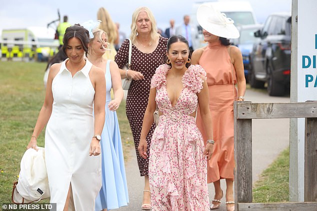 In another patterned selection, one woman stunned in a polka-dot dress - while another sported jewel tones in a deep emerald