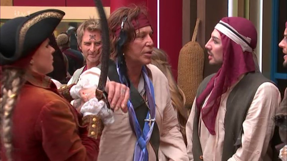 Mickey Rourke and other contestants in pirate costumes on Celebrity Big Brother.