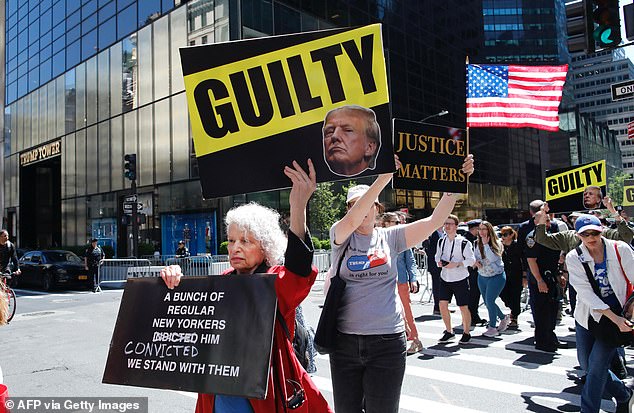 Protesters outside Trump tower in Manhattan on May 31, 2024 celebrate Trump's guilty conviction in the Stormy Daniels hush-money case