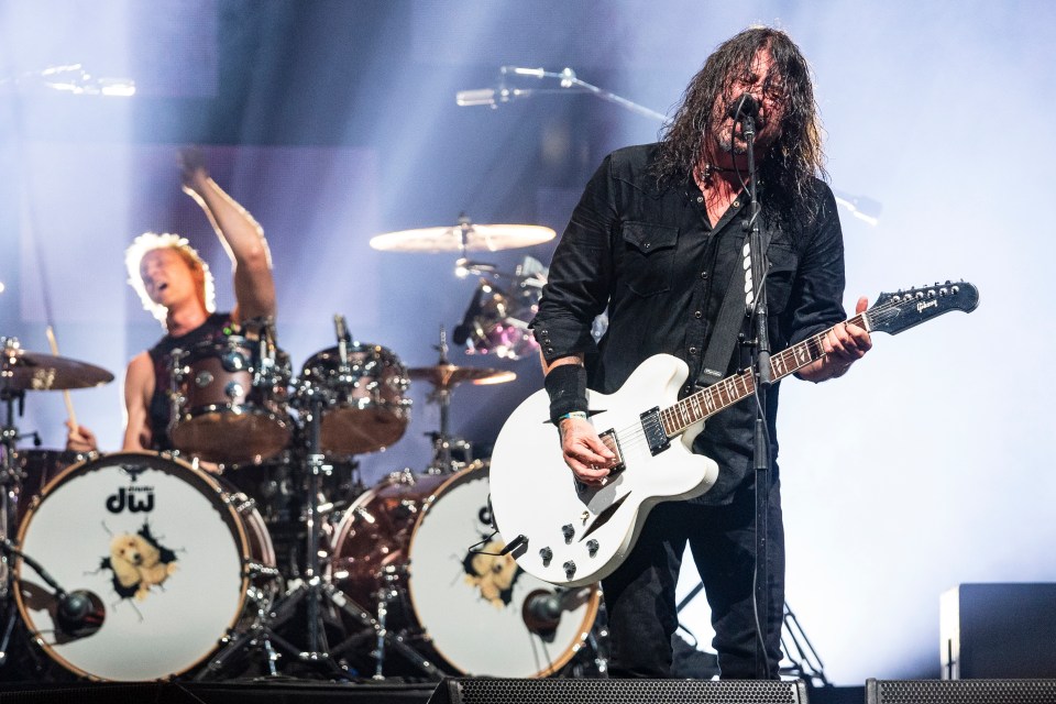 Dave Grohl of the Foo Fighters performing on stage.
