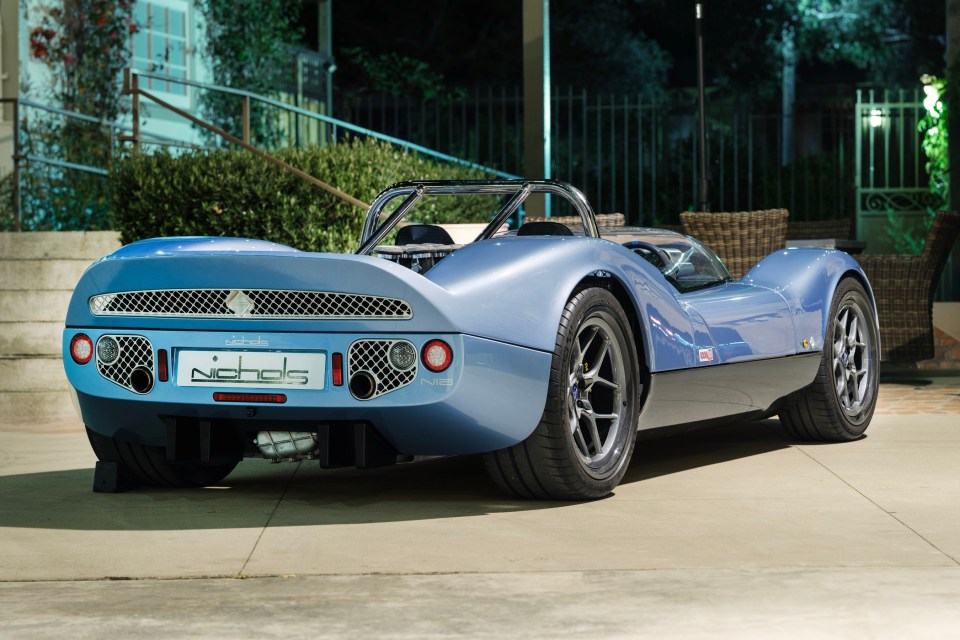 Rear view of a light blue Nichols N1A supercar.