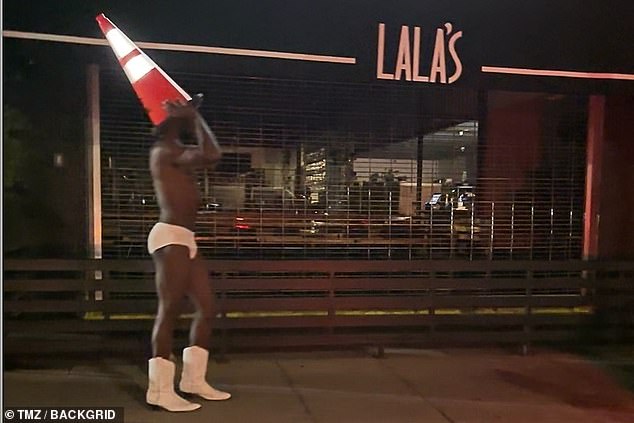 He even placed an orange traffic cone atop his head