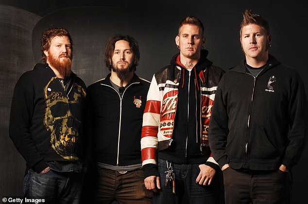 Hinds, who left Mastodon after 25 years in March 2025, was killed on Wednesday when his Harley-Davidson collided with a BMW SUV around 11.35pm per Atlanta News First - pictured L with bandmates Troy Sanders, Brann Dailor, Bill Kelliher in 2006