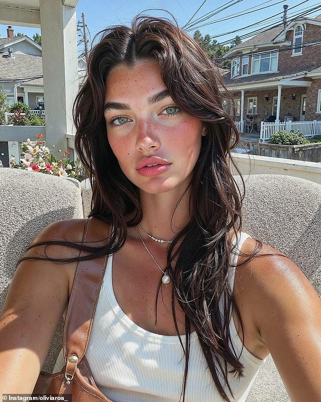 The Clueless has since launched other AI influencers such as Olivia Roa (pictured), with similarly 'aspirational' looks and bodies (AI–generated image)