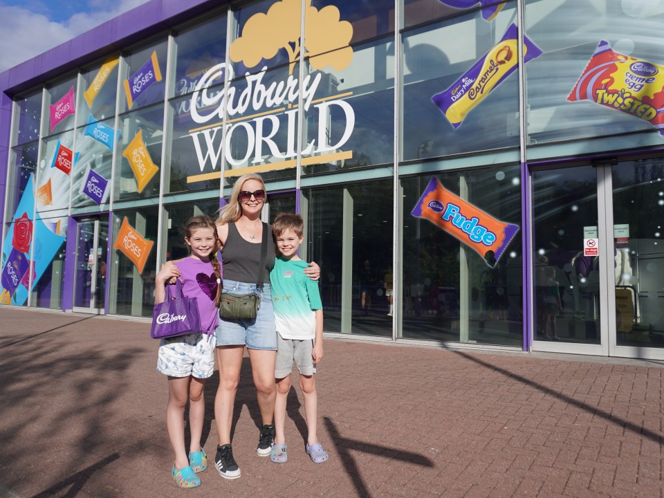 Family posing in front of Cadbury World.
