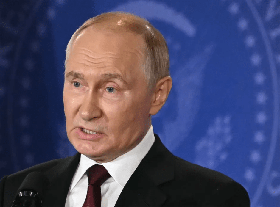 Vladimir Putin speaking at a press conference.