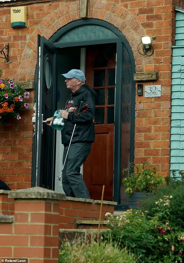 Pictured: A couple of hours after her release husband Ray Connolly left the house with a set of golf clubs