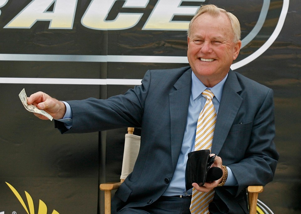 H.A. "Humpy" Wheeler, president and general manager of Lowe's Motor Speedway, holding money.