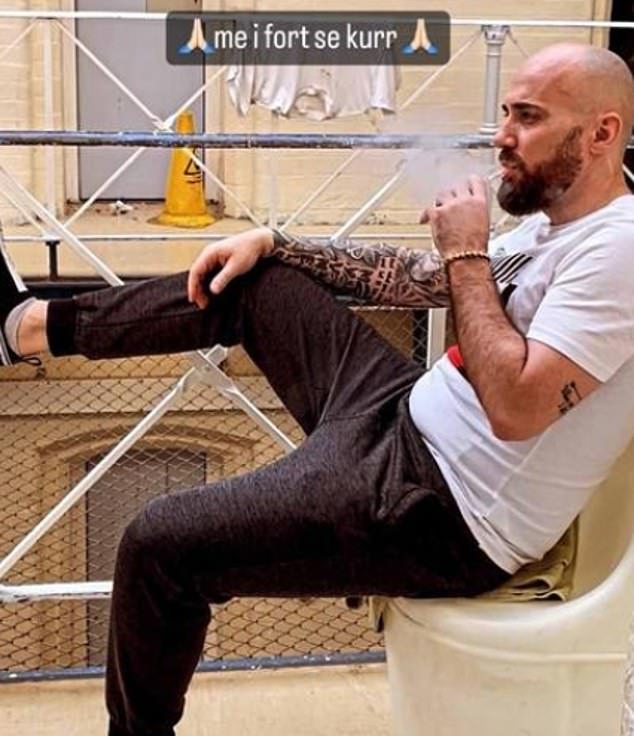 Merizaj has posed on Instagram wearing £550 Dolce & Gabbana trainers outside his cell vaping with the caption 'stronger than ever' written in Albanian