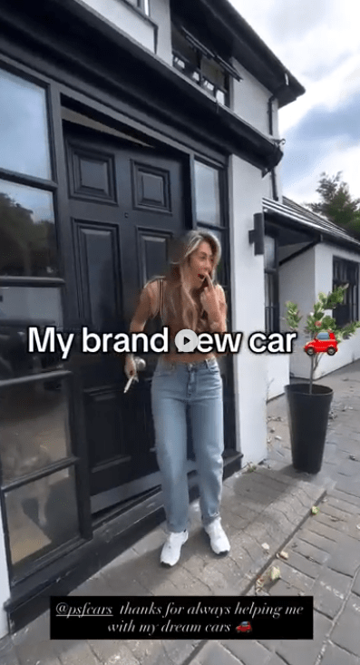 Woman reacting excitedly to her new car.