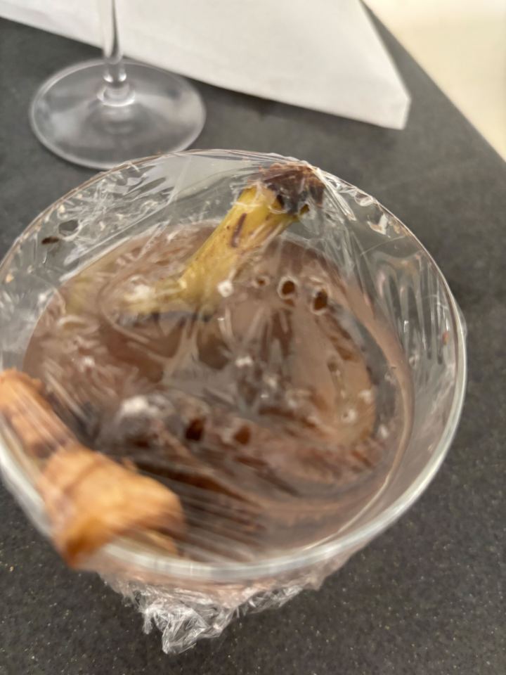 Fruit fly trap in a glass.