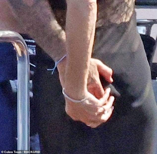 David couldn't wipe the smile off his face as he pinched Victoria's bum