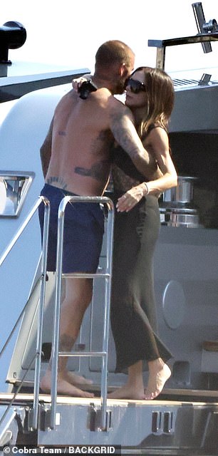 David and Victoria looked happier than ever as they packed on the PDA
