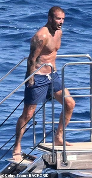 The football star later enjoyed a dip in the ocean alongside his sons
