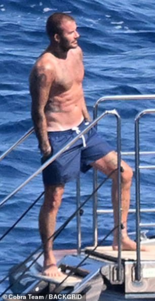 The football star later enjoyed a dip in the ocean alongside his sons