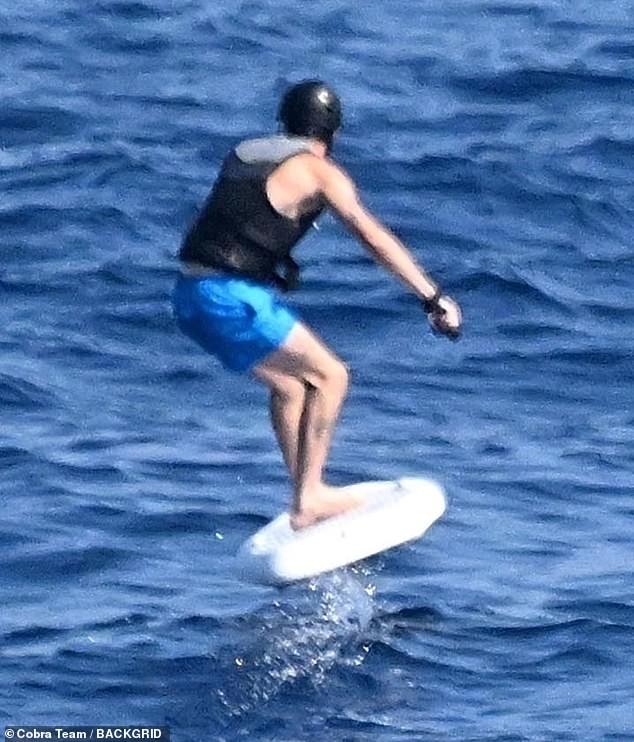 The family watched in delight as the pair hit the waves