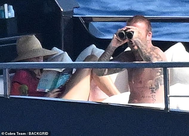 Later David took in the views while Victoria shielded beneath a srraw hat to read her book