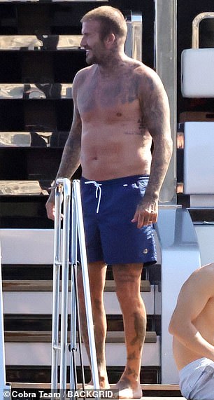 The England legend proudly displayed his sun-kissed physique as he strolled about the vessel