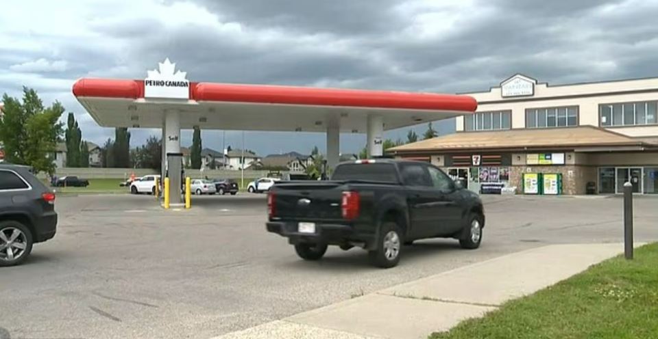 Petro-Canada gas station with a truck and cars.