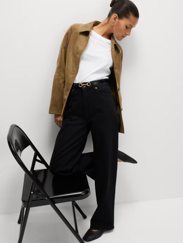 Model wearing a brown faux suede jacket.