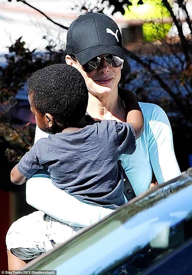 The actress adopted son Louis when he was three-and-a-half months old in 2010 (Pictured above in 2013)