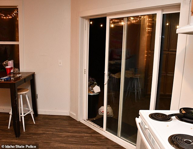 A back door leading out of the kitchen was wide open in the police photos