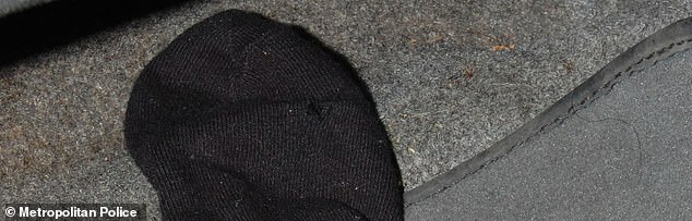 O'Connor's gun is seen pictured in the footwell of a car where it was concealed in a black sock