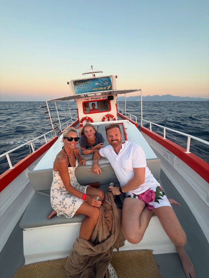 Jenni Falconer with her family on a boat.