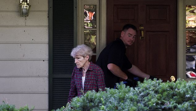 Gretchen Smith Bolton, wife of the former White House national security adviser John Bolton, walks away from Bolton's house as it is searched by FBI members, in Bethesda, Maryland, U.S., August 22, 2025. REUTERS/Tasos Katopodis     TPX IMAGES OF THE DAY