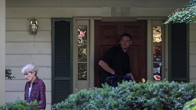 Gretchen Smith Bolton, wife of the former White House national security adviser John Bolton, walks away from Bolton's house as it is searched by FBI members, in Bethesda, Maryland, U.S., August 22, 2025. REUTERS/Tasos Katopodis