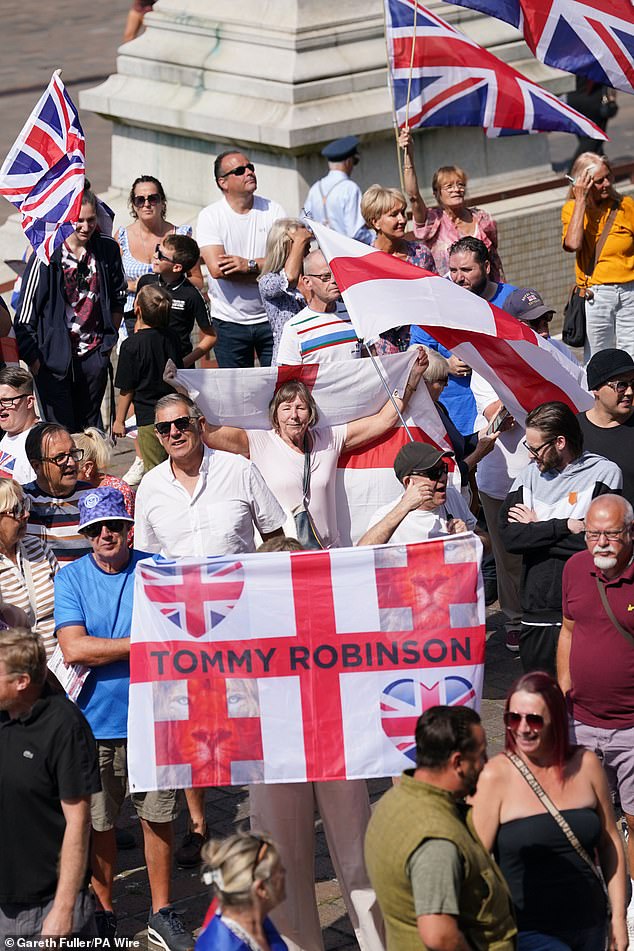 Police enforced a gap between the two groups as the anti-immigrant group chanted 'Send them home' while the counter group chanted: 'Refugees are welcome here'