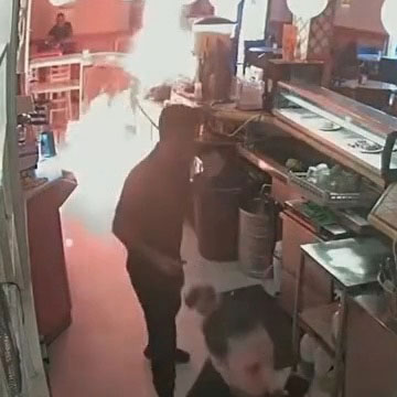 CCTV footage of a man setting fire to a cafe counter after being denied mayonnaise.