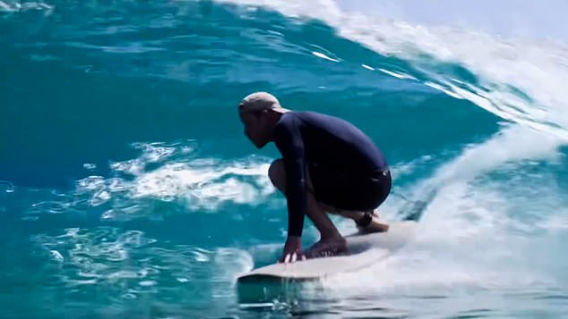 In the video, posted to both Meghan's Instagram feed and her story, Prince Harry can be seen crouching down as a blue wave encircles him