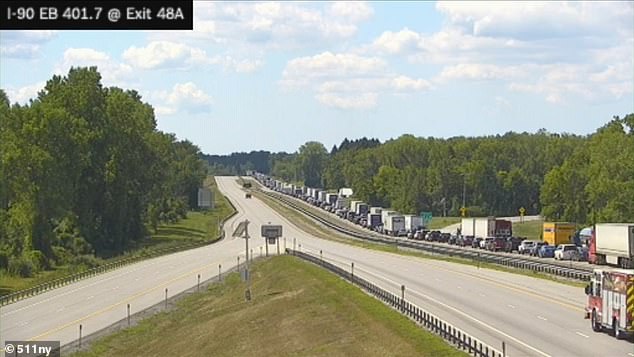 Traffic is at a standstill on I-90 this afternoon after a tour bus traveling eastbound lost control, went over the median and overturned in a ditch