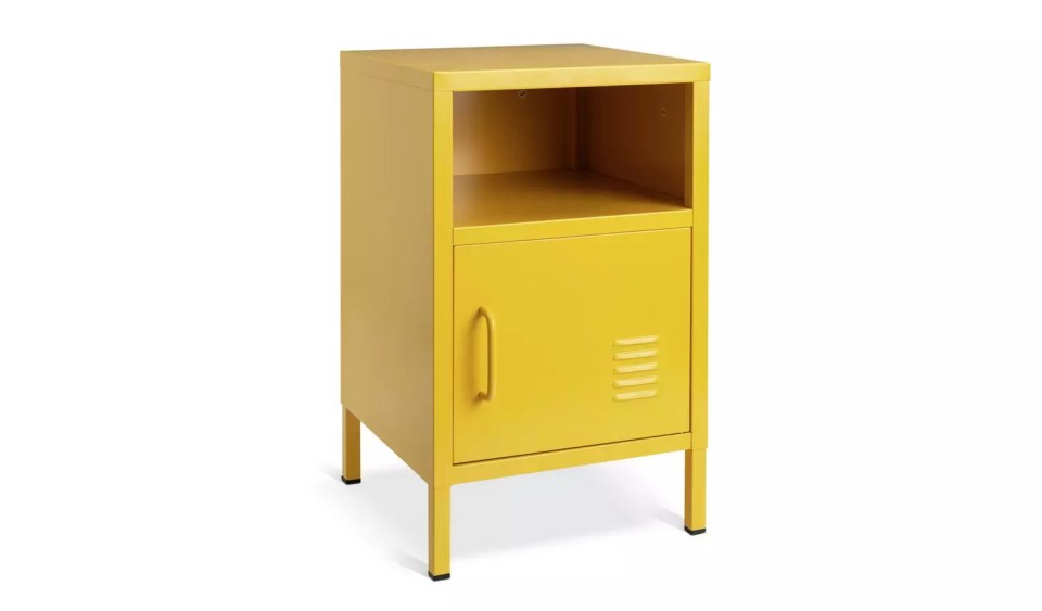 Yellow metal bedside table with small upper shelf and cupboard.