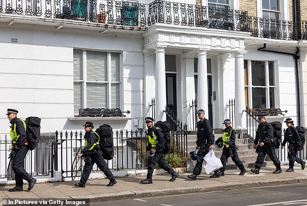 Police officers arriving before the start of last year's event, which is Europe's largest street party