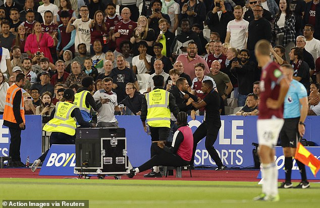 West Ham fans were spotted clashing with pitchside stewards during the Chelsea game