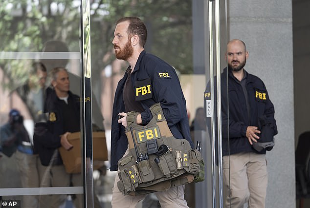 FBI agents were also seen raiding Bolton's office in Washington, DC
