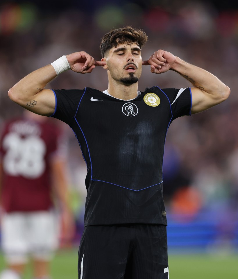Pedro Neto of Chelsea celebrating a goal, fingers in ears.