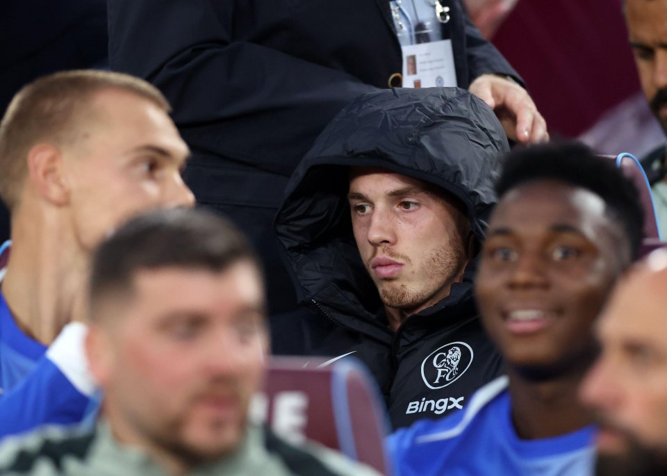 Cole Palmer of Chelsea on the bench after a warm-up injury.