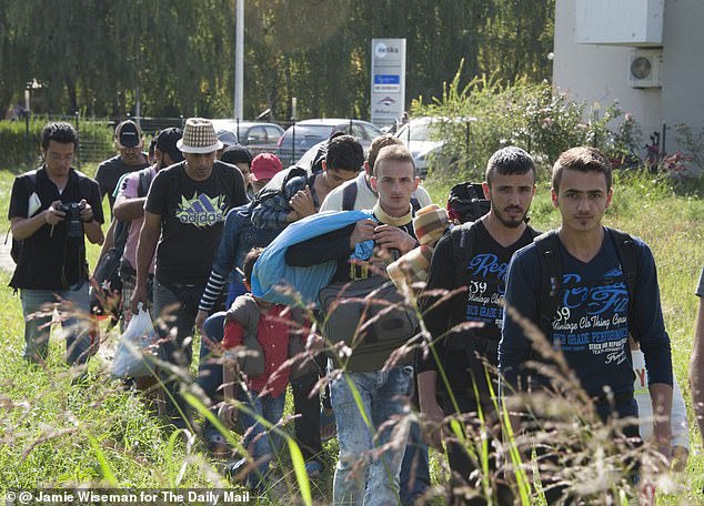 Migrants at the Porin Hotel on the outskirts of the Croatian capital Zagreb set off on foot for the rail station where they later boarded a train for Slovenia in 2018