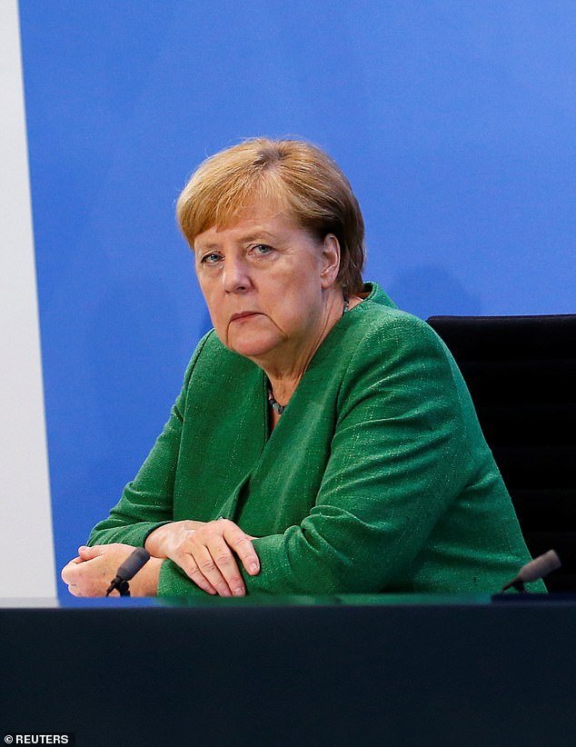 By the time Mrs Merkel (above) made her famous 'Wir Schaffen Das' speech, nearly 11,000 migrants a day were pouring into German cities such as Munich
