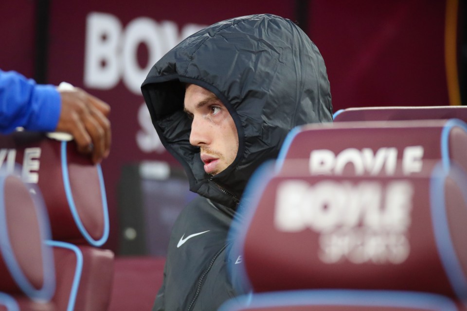 Cole Palmer of Chelsea on the bench at a Premier League game.