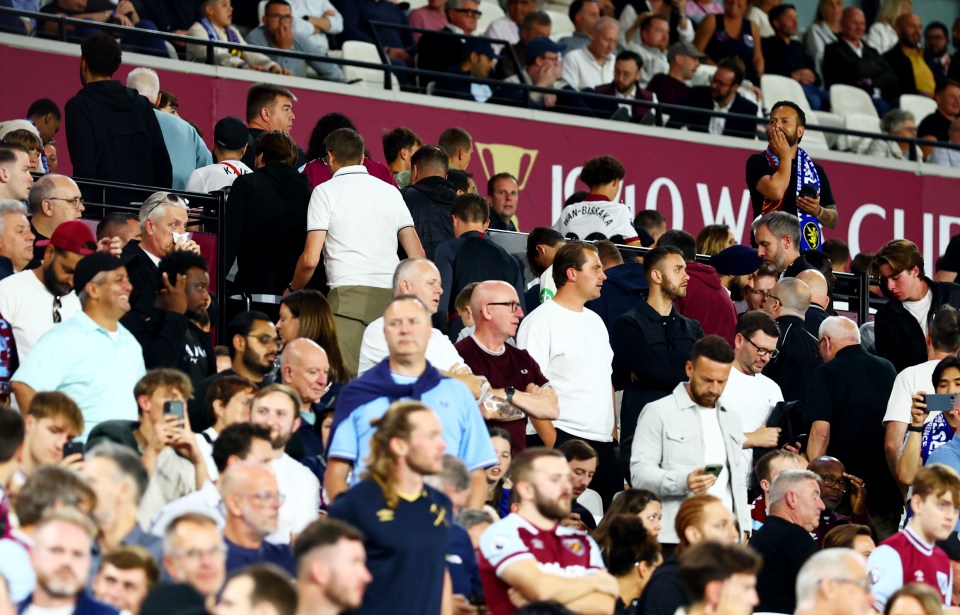 West Ham fans leaving the stadium early during a Premier League match.
