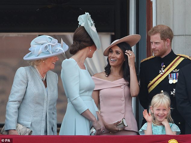 The main criticism Meghan attracted for her first balcony appearance was her outfit of choice: An off-the-shoulder Carolina Herrera dress in a soft blush pink shade with a matching Philip Treacy hat