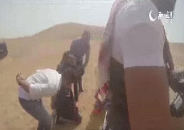 They are then made to kneel in the sand presumably fearing they will shot or beheaded before the stunt is finally revealed