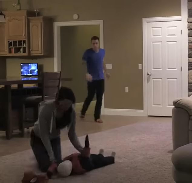 She runs over to her fake son in a frenzy and pulls off his mask, revealing that it was only a mannequin that went over the side